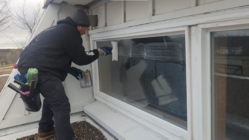 Treating mineral deposits on coastal window glass